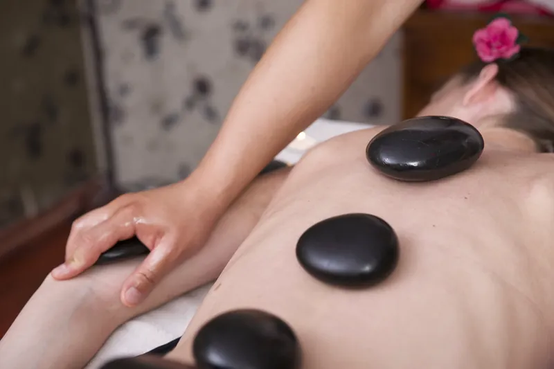 Stress relief massage with warm stones